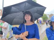 Lyn's umbrella actually keeps the rain off