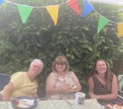 Jan, Sandra & Vicky: under the bunting